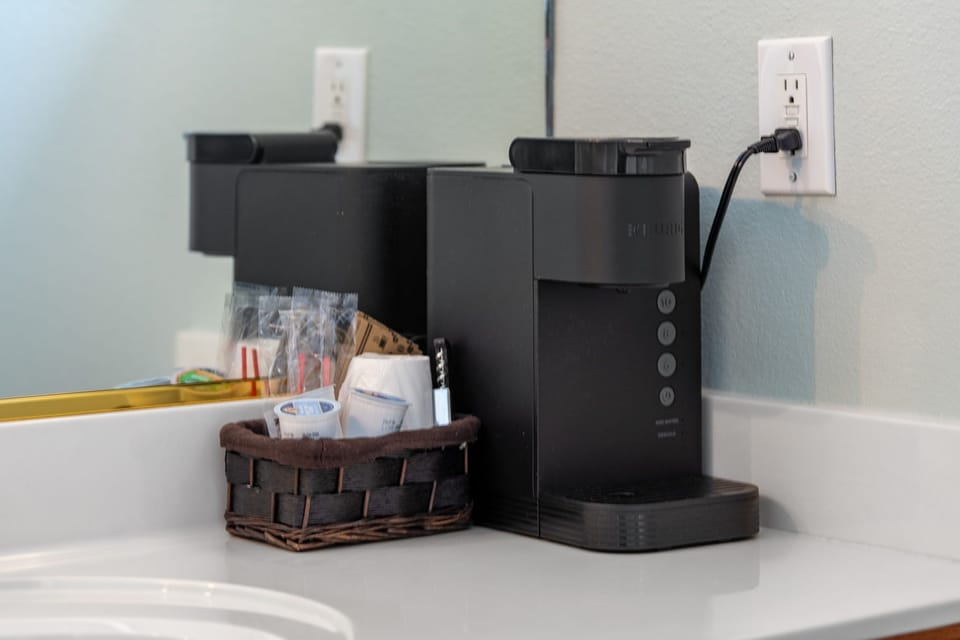 Start your day right with a fresh cup of coffee, brewed just steps from your bed.