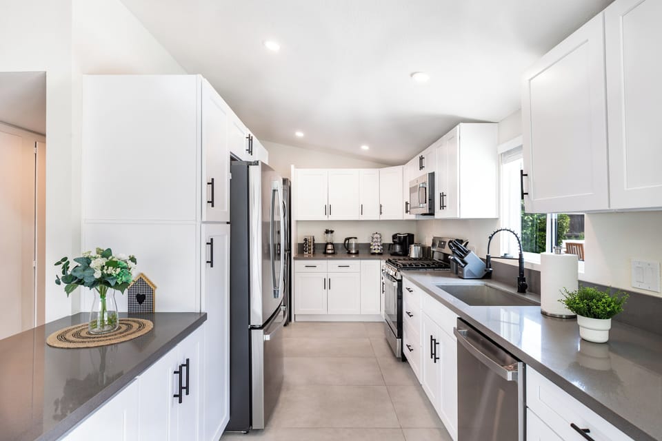 Fully equipped kitchen with modern appliances and clean layout