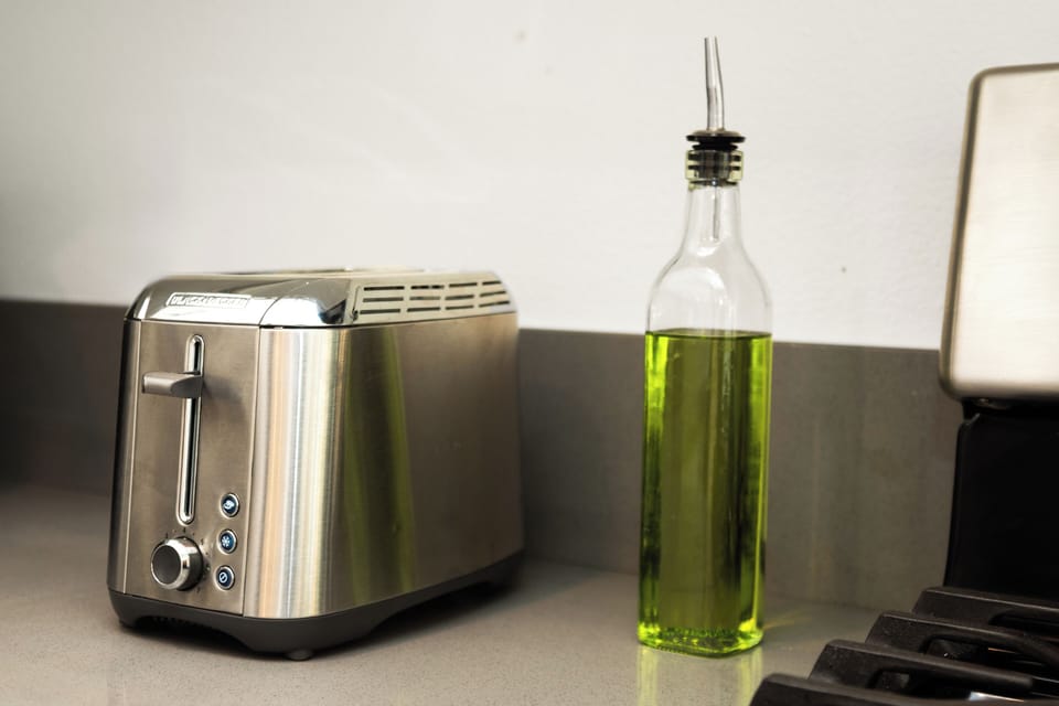 Modern toaster and olive oil set for easy breakfasts and cooking