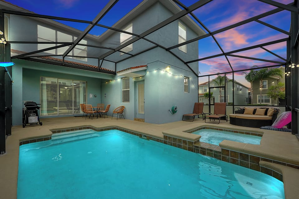 Enclosed saltwater spa and pool lounge area that’s been recently resurfaced, surrounded by privacy screens and optional heating (for a minimal fee)
