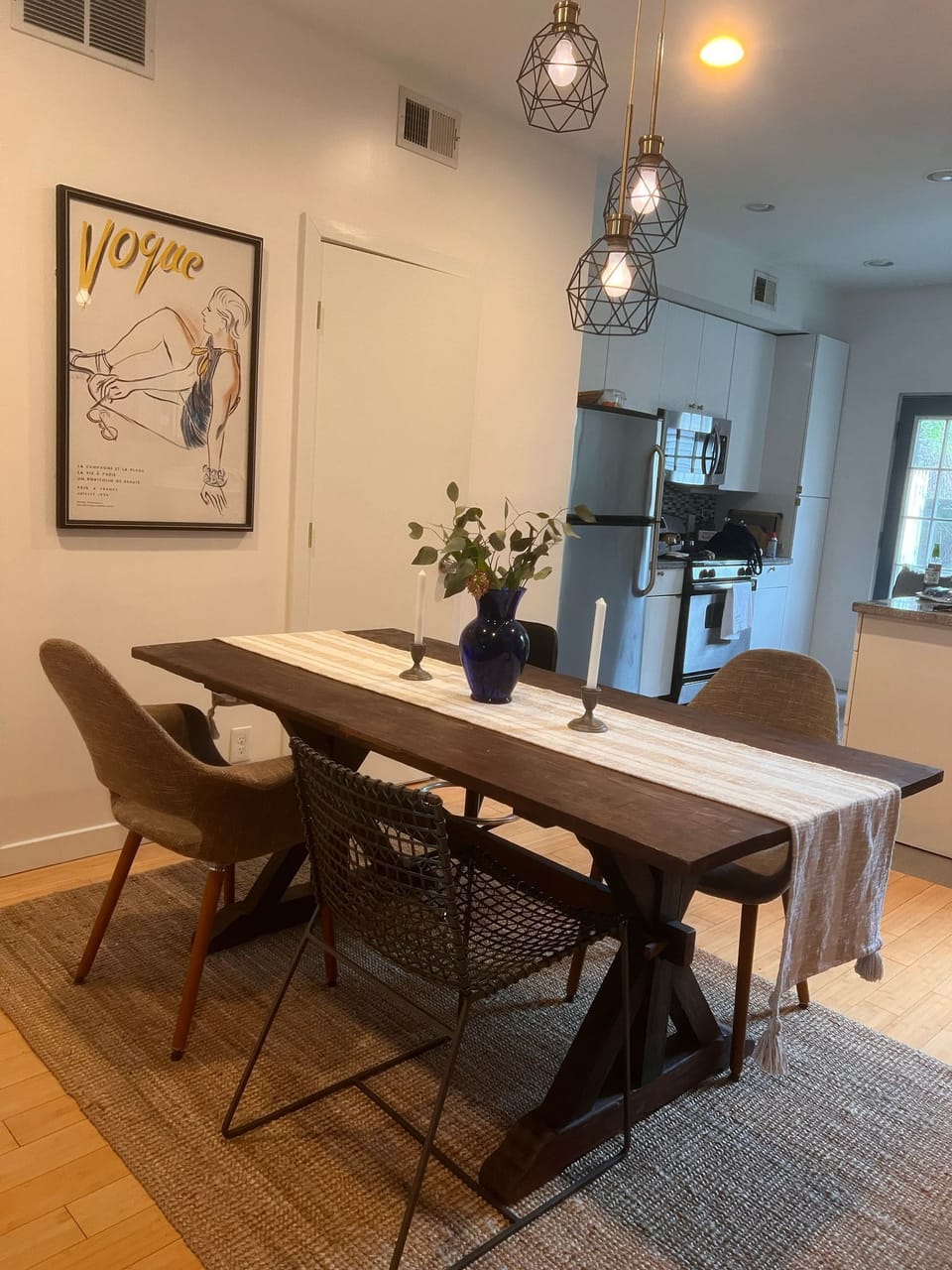 Minimalist dining space, perfect for cozy meals or work, with vintage charm.