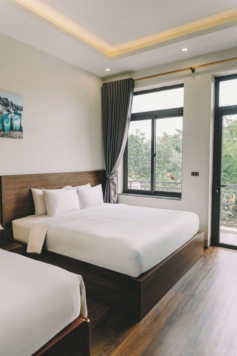 Deluxe Quadruple Room, Non Smoking, Balcony | Desk, laptop workspace, blackout drapes, soundproofing