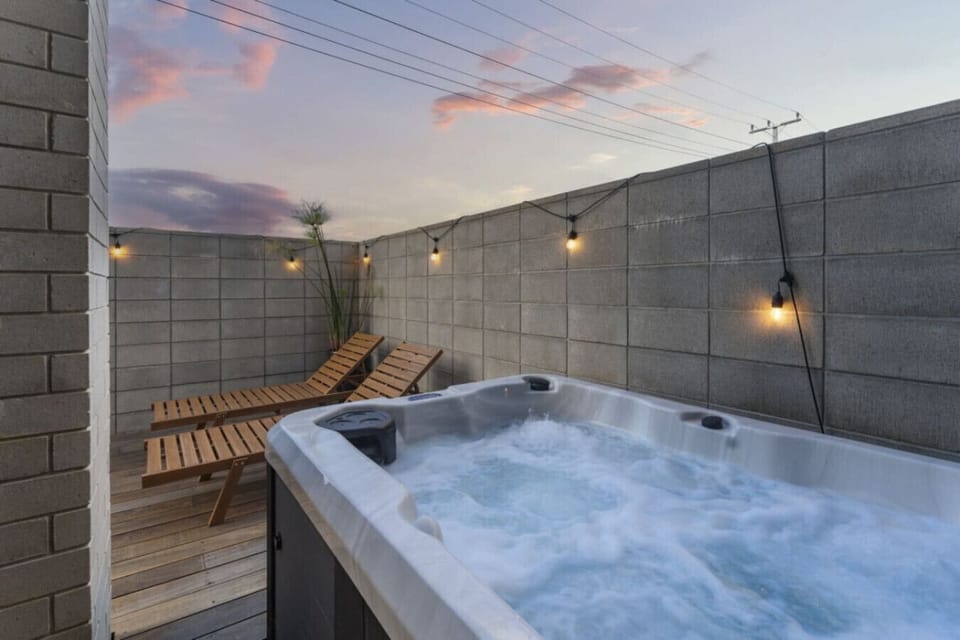 Sink into your private spa as the sun sets over the ocean, bubbling jets warming you while fairy lights twinkle above.