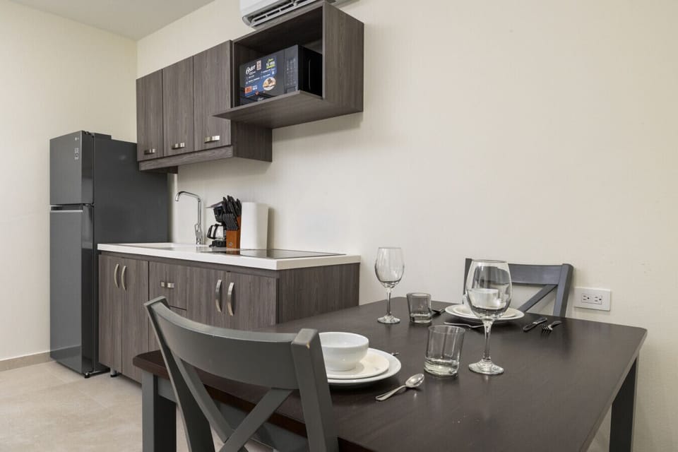 Dining made easy at Palm Beach 623! Enjoy meals in this cozy kitchen and dining area, complete with all the essentials for a delightful stay.