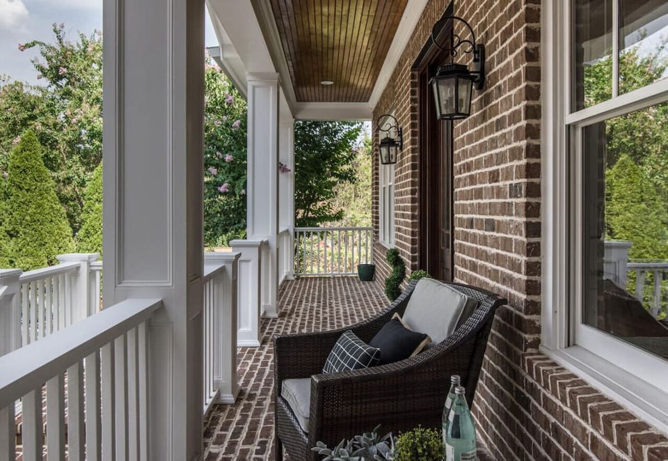 Two large balconies and a screened in porch at this spacious home.