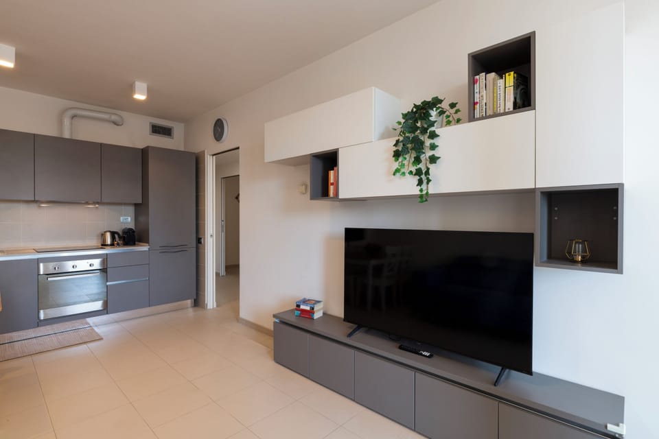 Deluxe Apartment | Living area | 55-inch Smart TV with digital channels