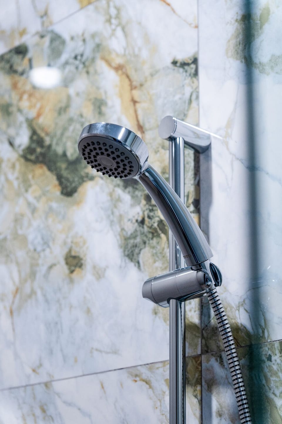 Shower, hair dryer, slippers, towels