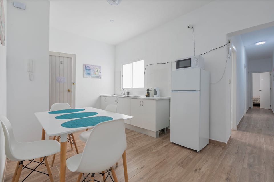 Full-size fridge, microwave, stovetop, cookware/dishes/utensils