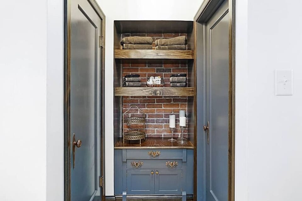 This custom cabinet and shelf nook is full of travel size amenities, just in case you forget something. Plus, we provide plush towels.