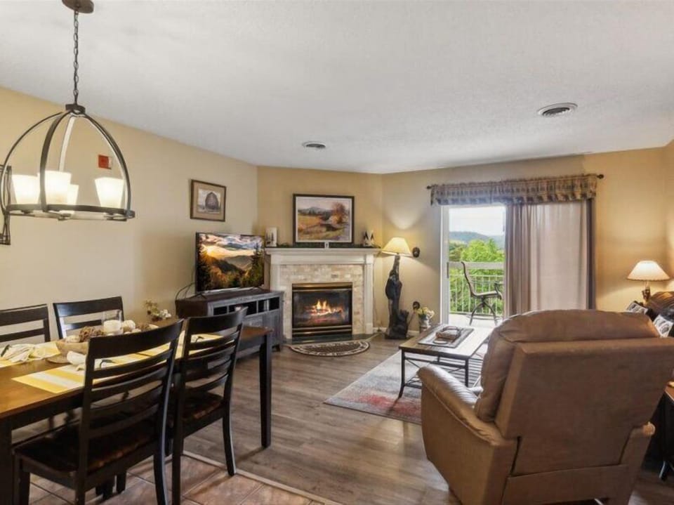 Spacious Living Room with Gas Fireplace, Sleeper Sofa and SMART TV with Cable & WIFI throughout vacation rental