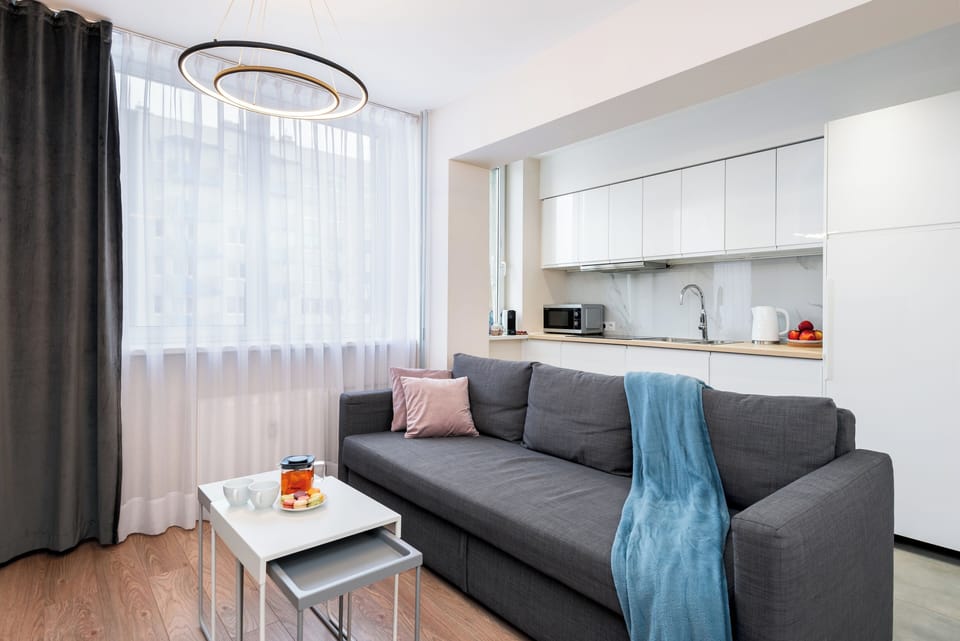 Comfort Apartment, Balcony, City View | Living area | 50-inch Smart TV with satellite channels, Netflix, streaming services