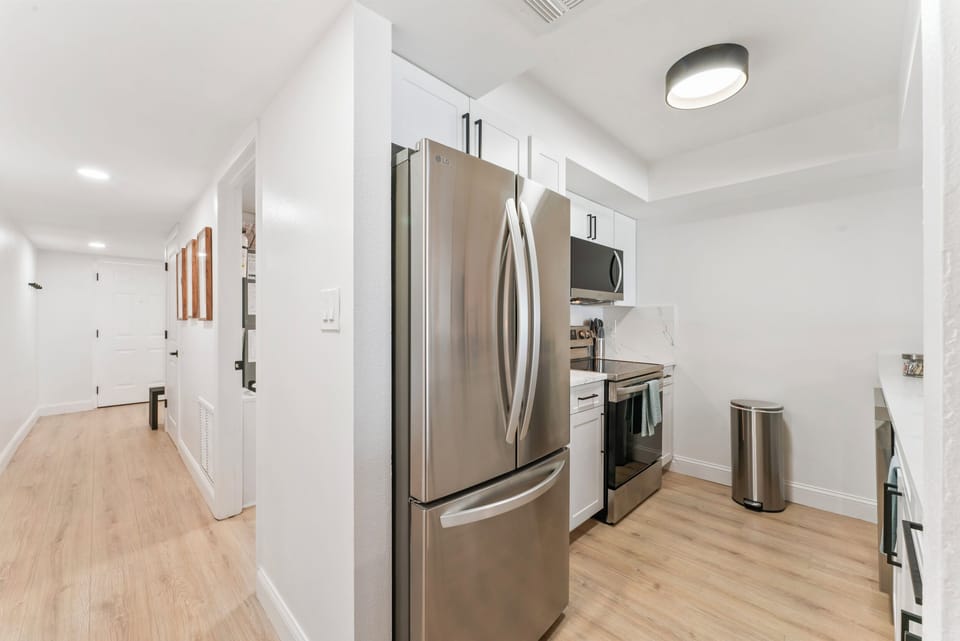 Fully stocked kitchen with stainless appliances and all the essentials for beachfront dining.