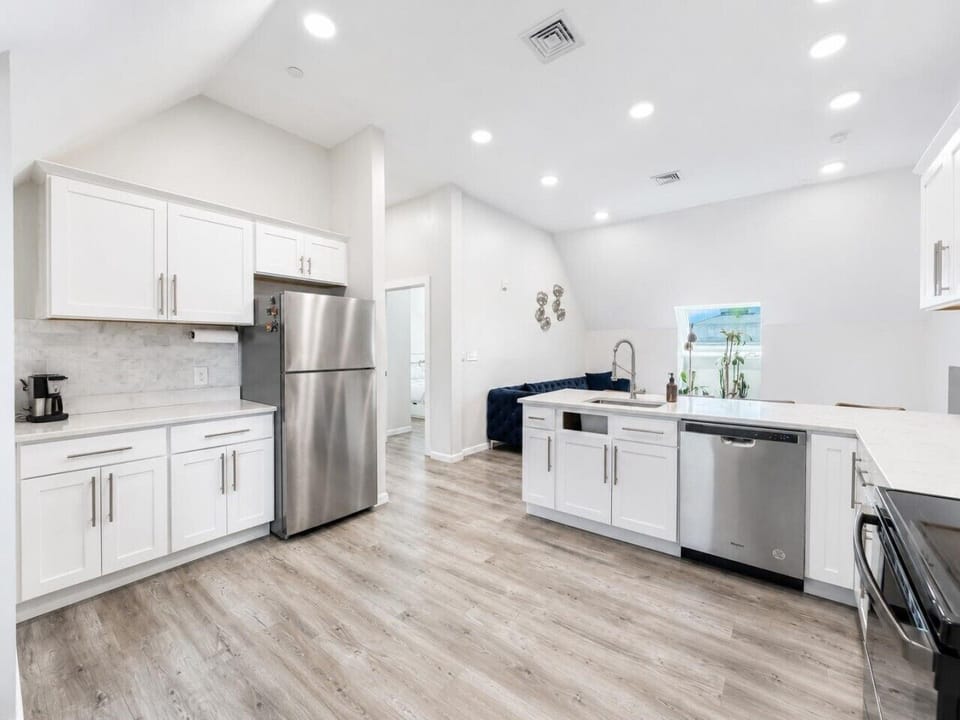 Fully equipped kitchen with stainless steel appliances and ample counter space