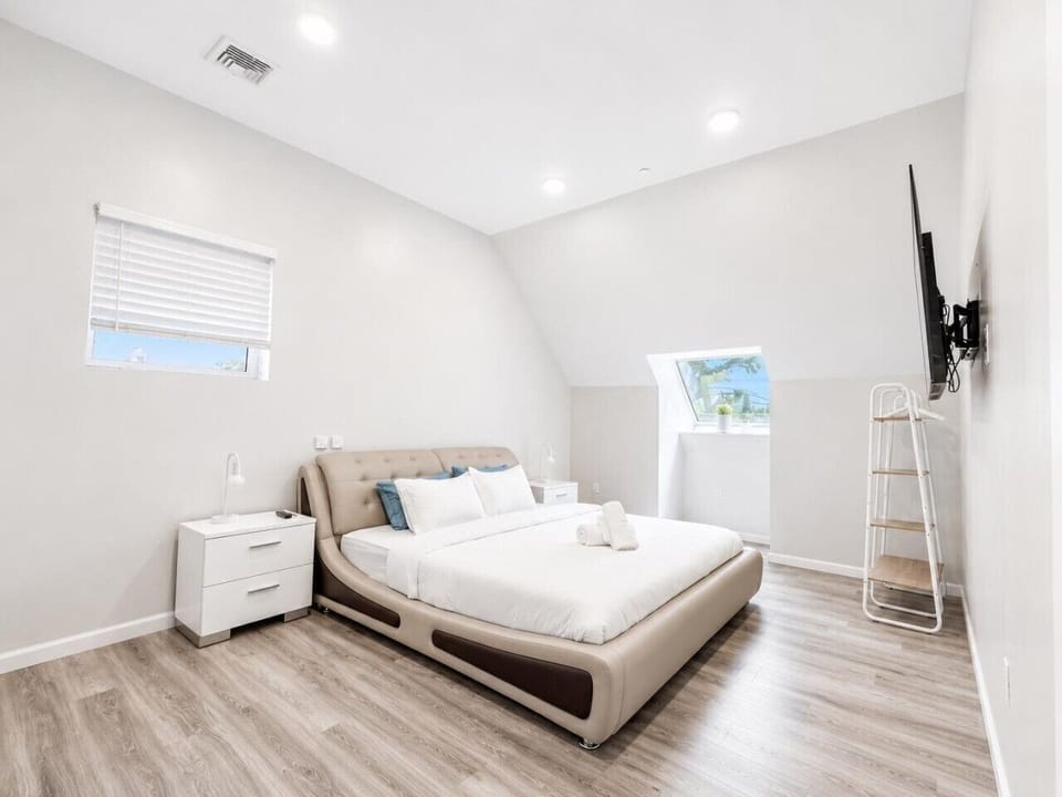 Spacious second bedroom with a Smart TV