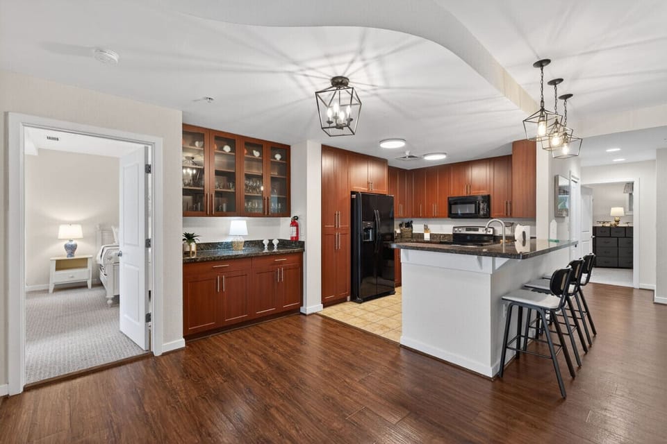 Cook, sip, and socialize in this beautiful kitchen featuring bar seating and everything you need for vacation dining.