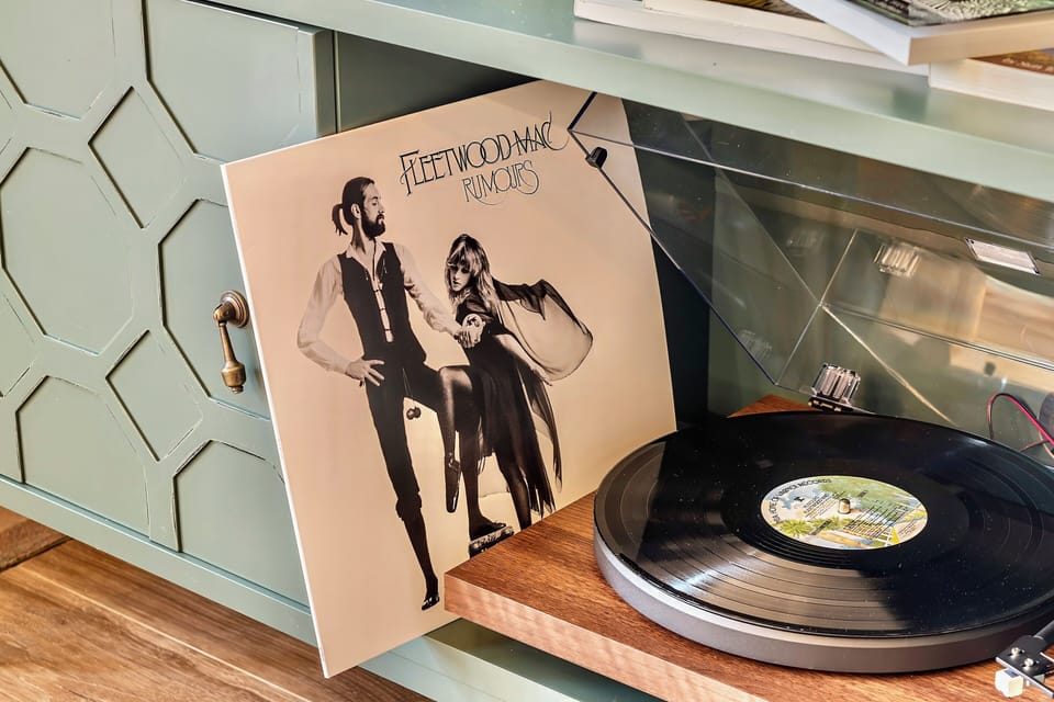 A record player & vinyl from multiple genres is music to your ears!
