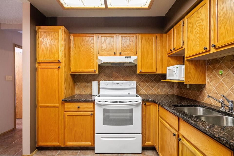 Full kitchen, on the main floor, with a blender, drip coffee maker, ground coffee, tea & sugar.