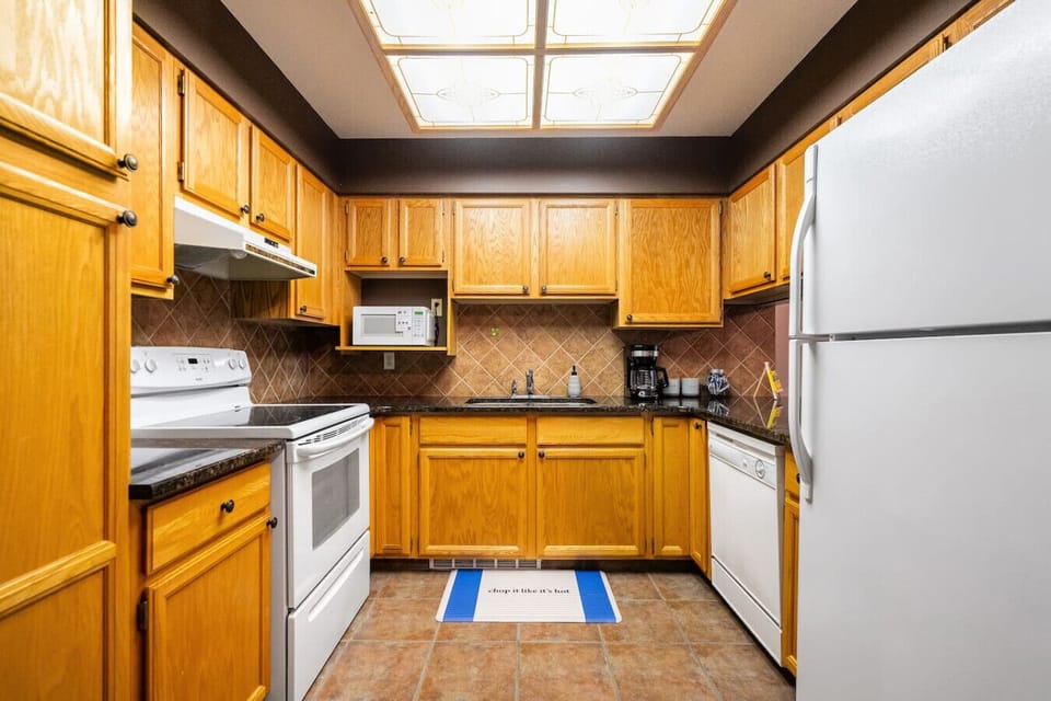 Full kitchen, on the main floor, with a blender, drip coffee maker, ground coffee, tea & sugar.