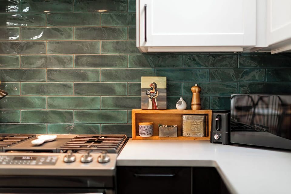 Range with vent, microwave, toaster, and a full spice drawer.