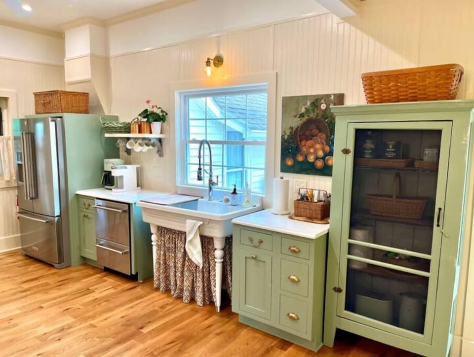 Farmhouse kitchen sink overlooking deck and garden 