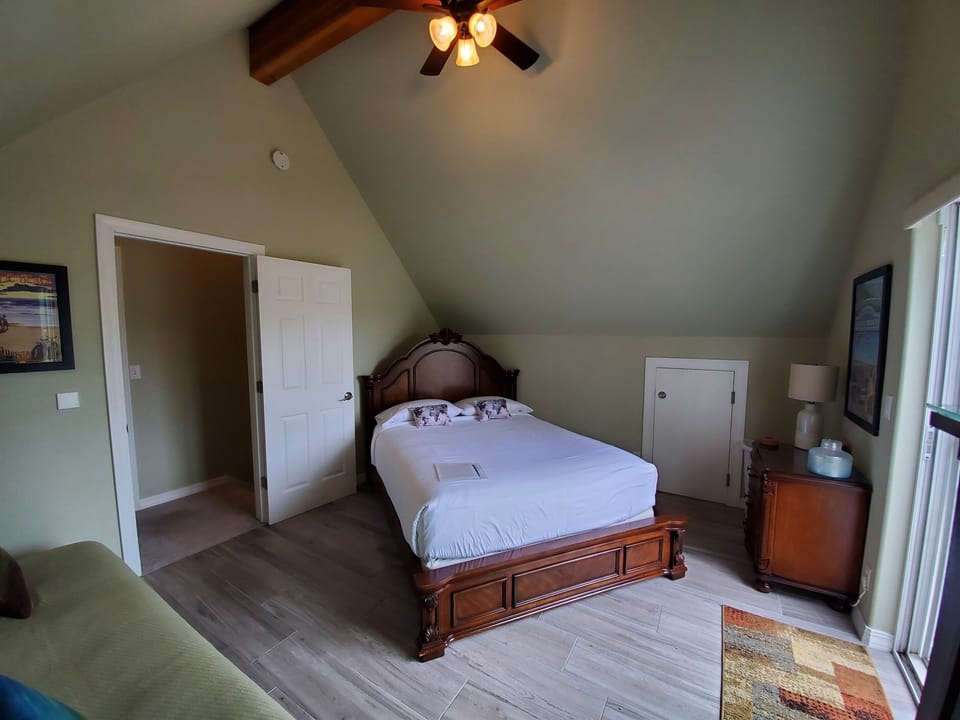 Bedroom 3 with queen bed and full-sized Euro lounger, armoire, and drawer space