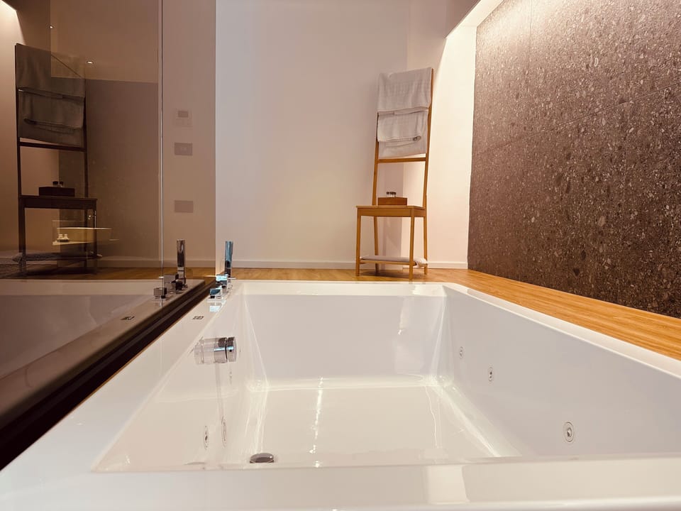 Superior Triple Room, Balcony, Courtyard View | Bathroom | Separate tub and shower, hair dryer, bidet, towels