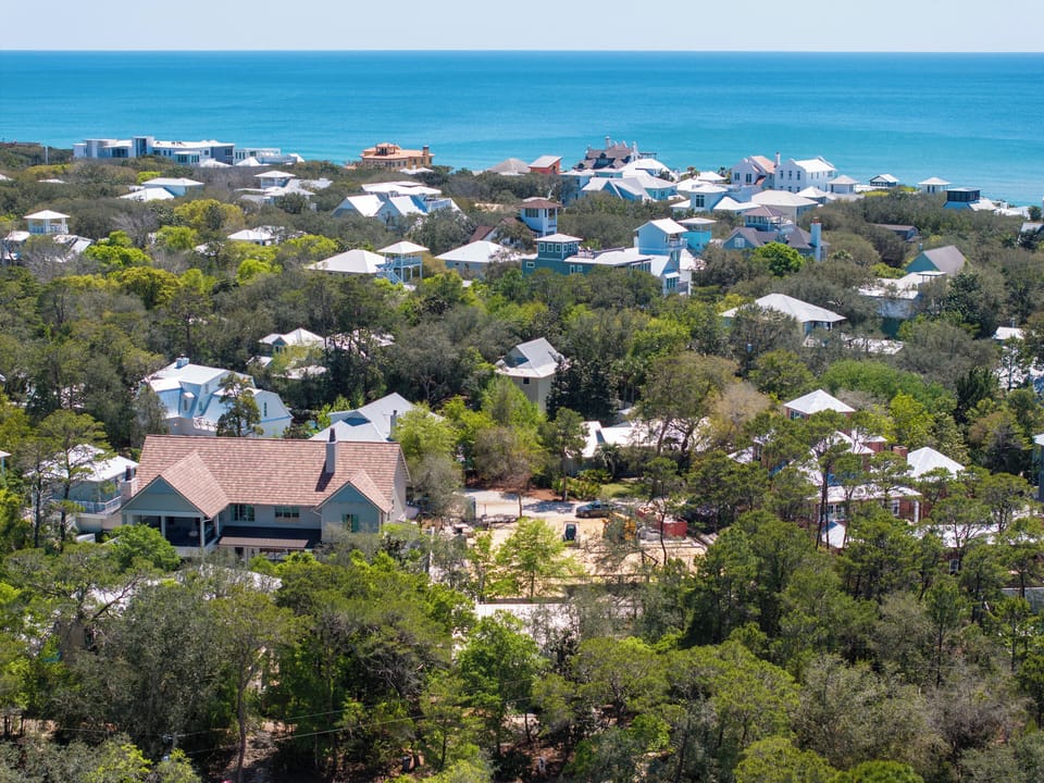 White roof in the center, lower 1/3 of this photo... a short walk to the beach.