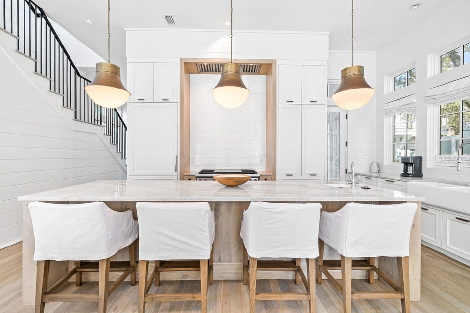 Chef's Kitchen with Natural Lighting, Luxury Island Seating, and Custom Cabinetry