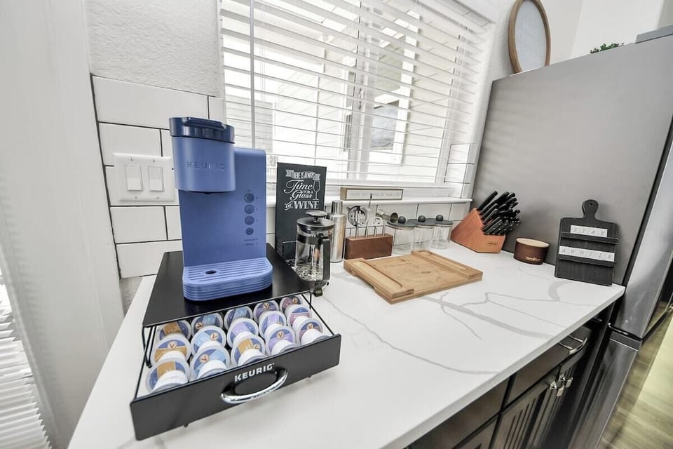 Enjoy a coffee on us! Just pick your favorite flavor from the tray below. This area also includes a corkscrew, shakers, & all the things for mixing up your favorite cocktail. A brand new knife set is also included to make life easier :)