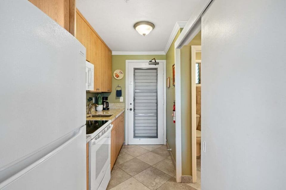 Compact yet complete studio kitchen with everything needed for preparing meals during your stay