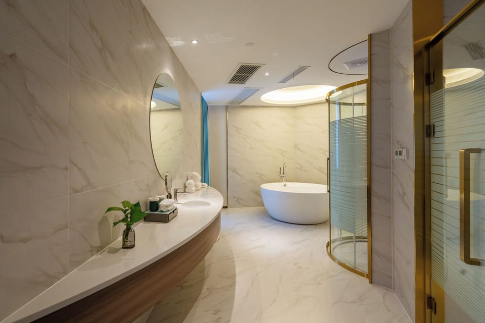 Basic Suite | Bathroom | Hair dryer, slippers, towels, soap