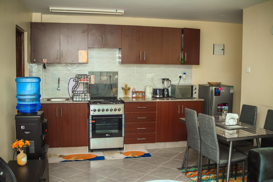 Family Apartment, Balcony, City View | Private kitchen | Fridge, microwave, cookware/dishes/utensils