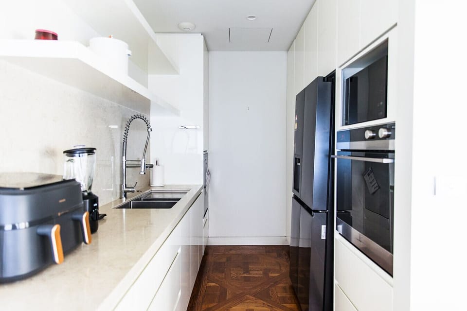 Cook like a pro in this gourmet kitchen complete with double ovens, a wine cooler, and high-end appliances.