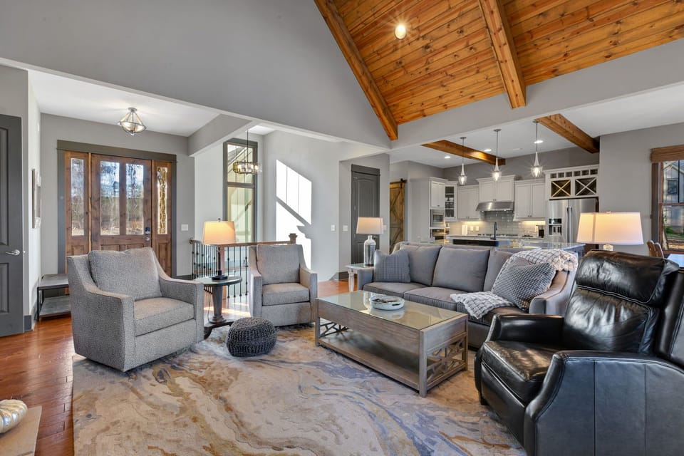 Soaring vaulted ceilings and ample seating create a spacious yet cozy retreat.