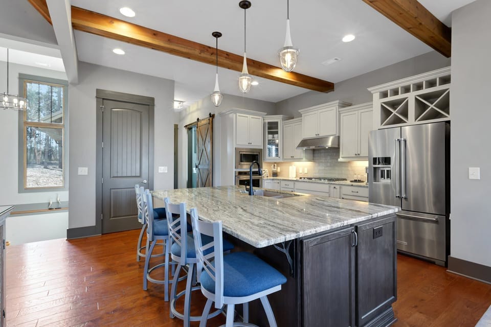 Features high-end appliances and ample cabinetry—perfect for effortless cooking and entertaining.