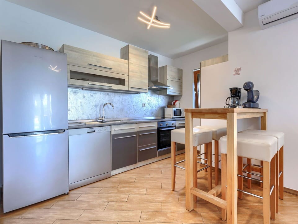 Furniture, Kitchen, Countertop, Flooring, Kitchen Appliance, Major Appliance, Interior Design, Wood, Cabinetry, Floor