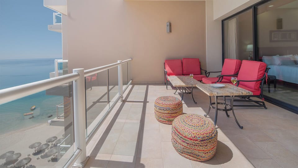 the balcony with sofas and hassocks