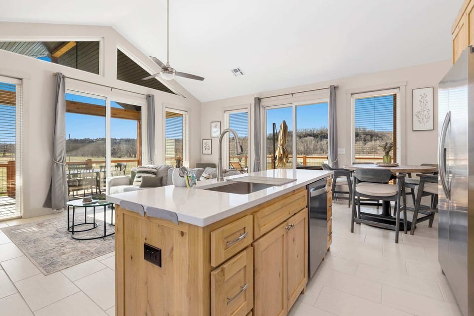 Whether you're preparing delicious meals in the fully equipped kitchen or enjoying a card game at the dining table, the seamless flow of this space ensures everyone can be part of the fun.