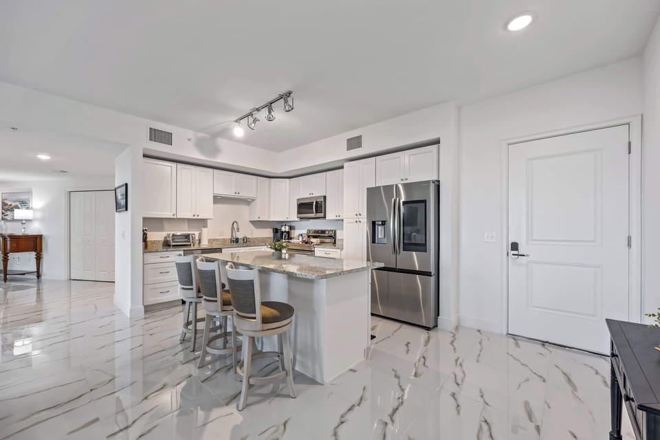 Modern kitchen with granite countertops and stainless steel appliances