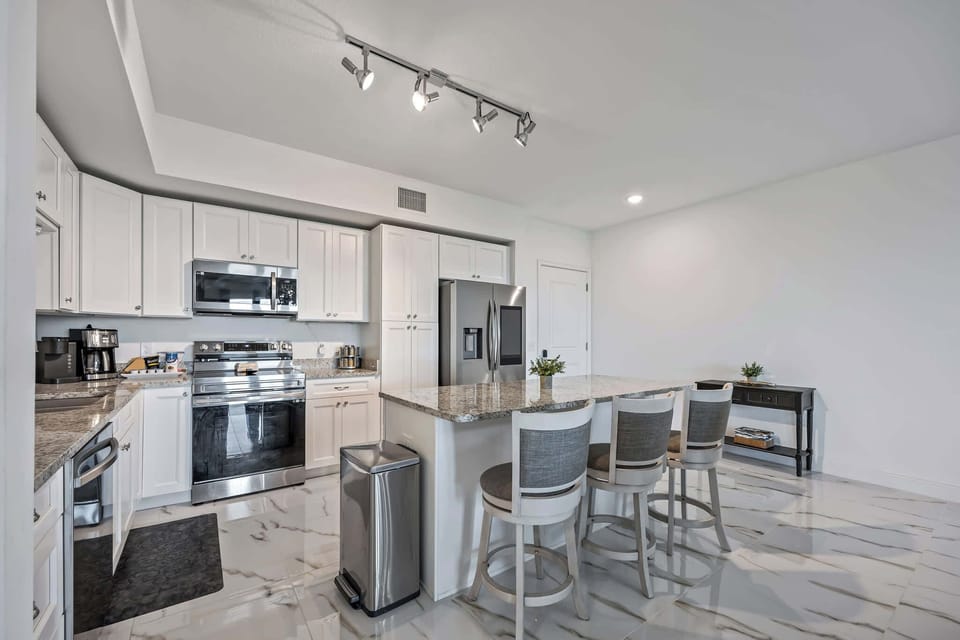 Modern kitchen with granite countertops and stainless steel appliances