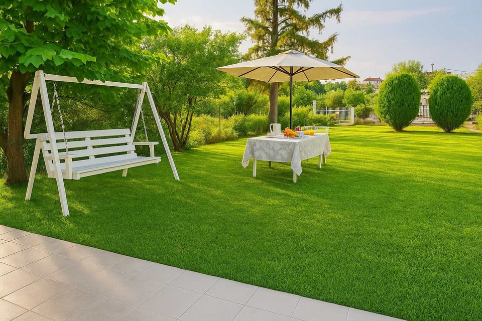 Garden with Swing & Outdoor Table
Green open space featuring a children's swing and table with chairs — ideal for families.
