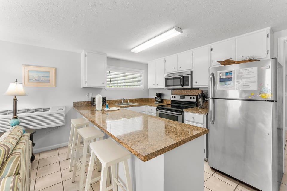 Modern kitchen with granite countertops and stainless steel appliances
