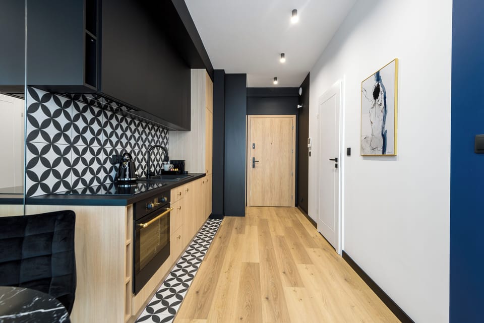 Luxury Apartment, Balcony, City View | Private kitchen | Full-size fridge, oven, stovetop, dishwasher
