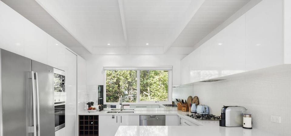 Well-equipped kitchen with breakfast bar seating for two 