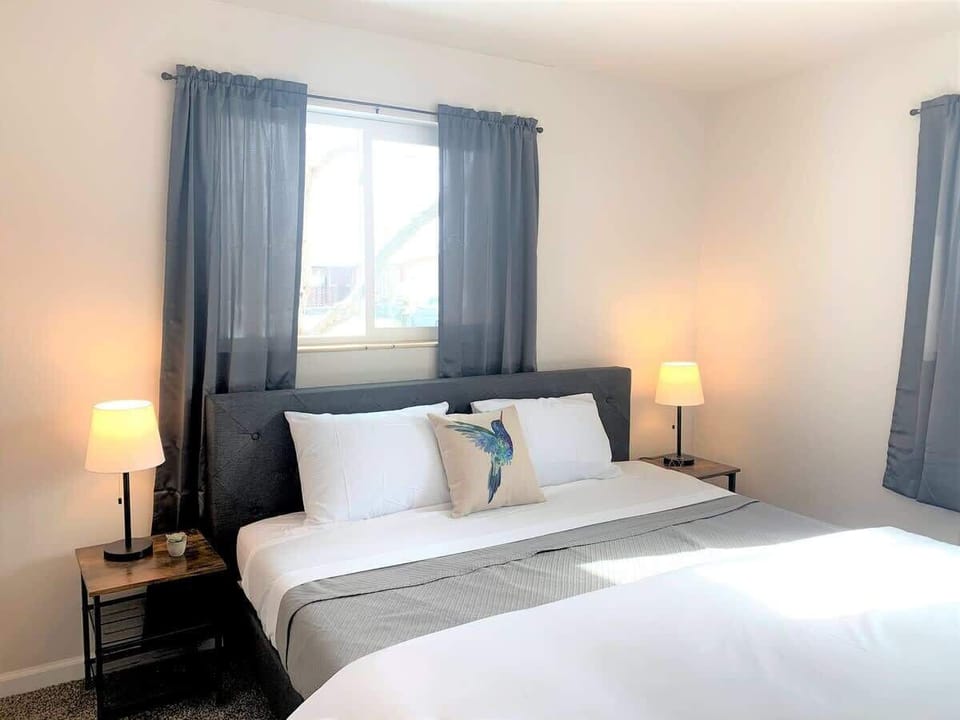 Modern King Bedroom #2 offers a spacious and stylish retreat, featuring a luxurious king-size bed, contemporary decor, and a relaxing atmosphere for a restful stay.