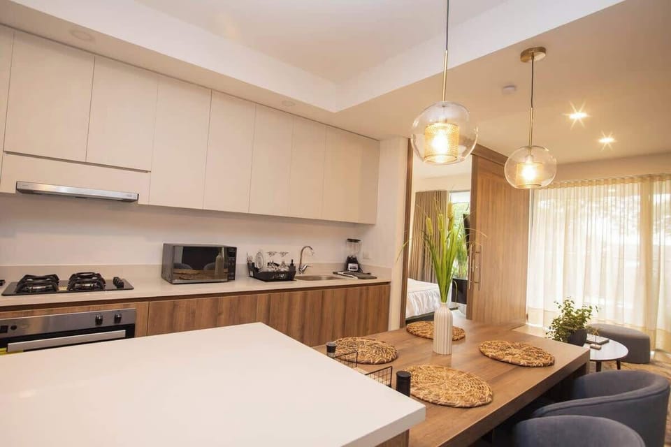 4 burner gas stove, gas oven, microwave, blender and other kitchen utilities. 