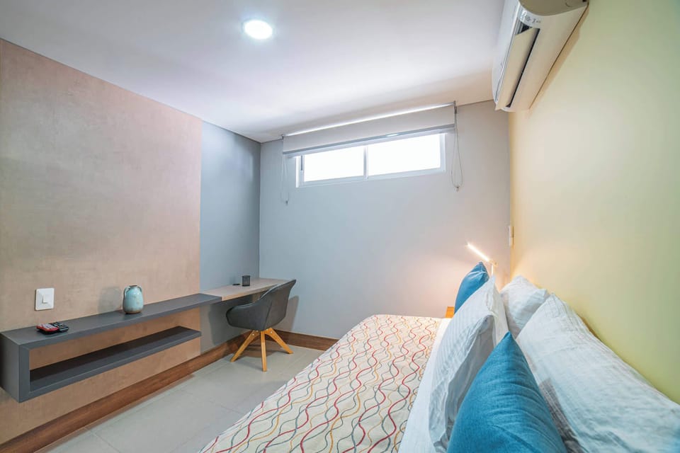 Single bed with stowaway mattress below.
Small desk with chair for small workspace. 