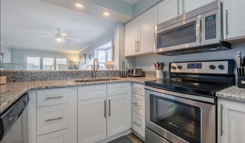 This bright, airy kitchen is perfect for entertaining guests or preparing a family meal. The open layout lets you stay connected to the living area while cooking.