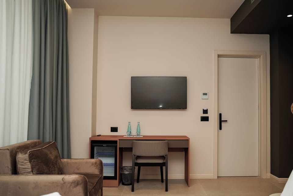 Deluxe Double Room, Balcony, Partial Sea View | Hypo-allergenic bedding, minibar, free WiFi, bed sheets
