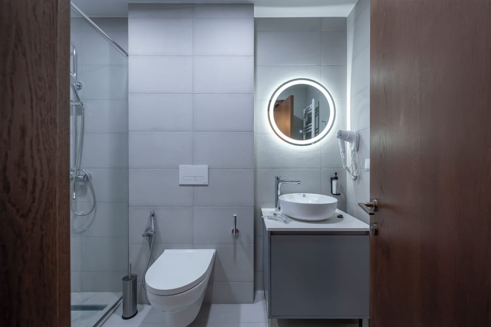 Designer toiletries, hair dryer, bathrobes, slippers